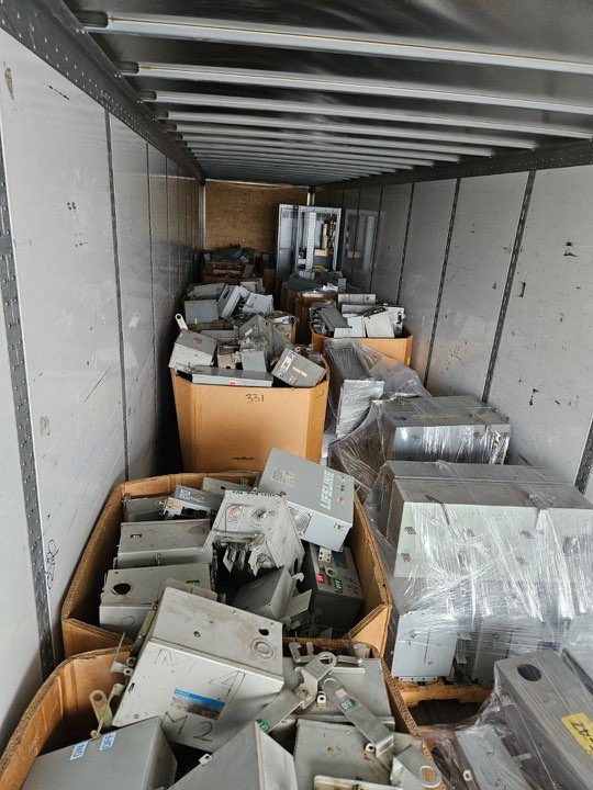 Fusible bus plugs crated in gaylord boxes inside a semi trailer
